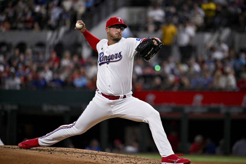 May 16, 2023; Arlington, Texas, USA; Texas Rangers starting pitcher Dane Dunning (33) pitches against the Atlanta Braves during the third inning at Globe Life Field. Mandatory Credit: Jerome Miron-USA TODAY Sports