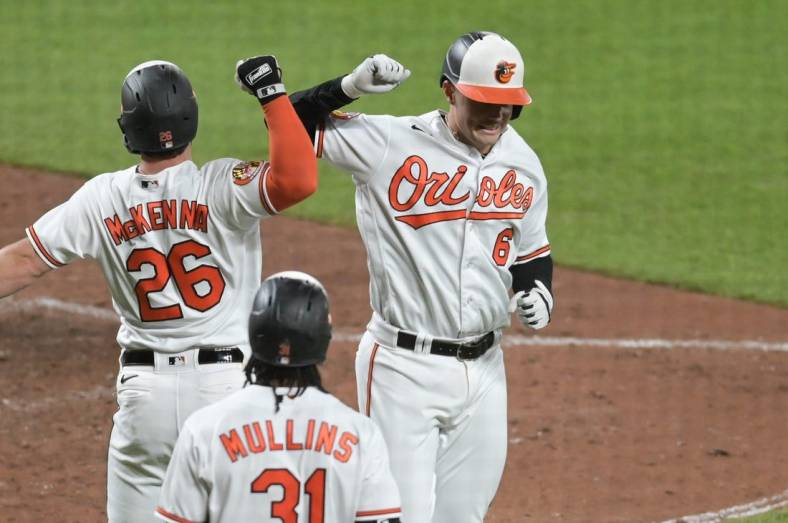 May 16, 2023; Baltimore, Maryland, USA;  Baltimore Orioles first baseman Ryan Mountcastle (6) celebrates with left fielder Ryan McKenna (26) after hitting a two run home run against the Los Angeles Angels at Oriole Park at Camden Yards. Mandatory Credit: Tommy Gilligan-USA TODAY Sports