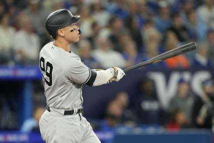 May 16, 2023; Toronto, Ontario, CAN; New York Yankees designated hitter Aaron Judge (99) watches his ball go over the center field wall for a two run home run against the Toronto Blue Jays during the eighth inning at Rogers Centre. Mandatory Credit: John E. Sokolowski-USA TODAY Sports