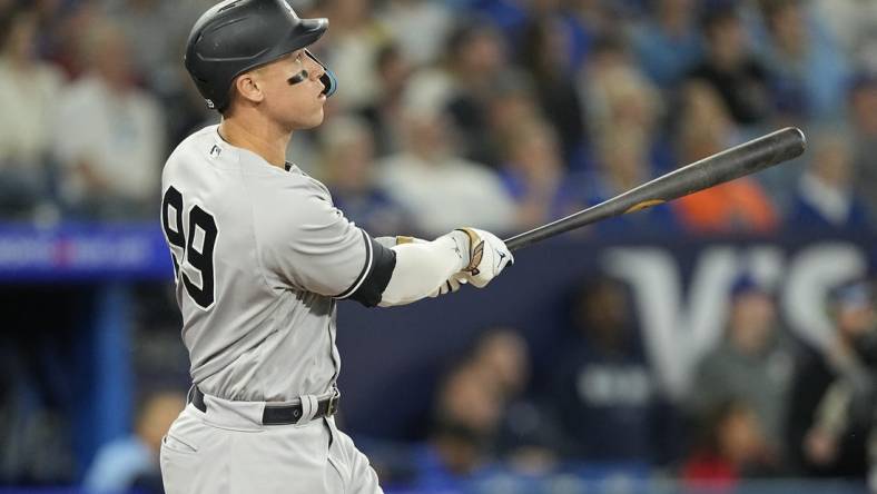 May 16, 2023; Toronto, Ontario, CAN; New York Yankees designated hitter Aaron Judge (99) watches his ball go over the center field wall for a two run home run against the Toronto Blue Jays during the eighth inning at Rogers Centre. Mandatory Credit: John E. Sokolowski-USA TODAY Sports