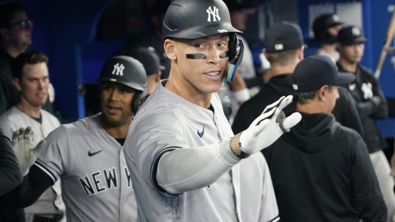 May 16, 2023; Toronto, Ontario, CAN; New York Yankees designated hitter Aaron Judge (99) celebrates in the dugout after hitting a two run home run against the Toronto Blue Jays during the eighth inning at Rogers Centre. Mandatory Credit: John E. Sokolowski-USA TODAY Sports