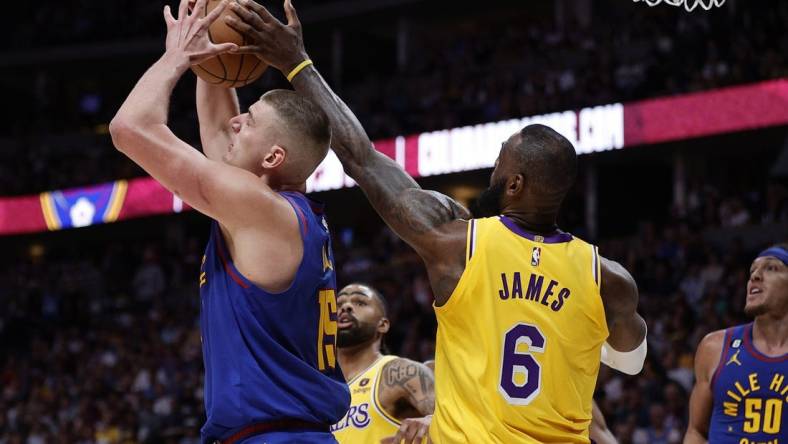 May 16, 2023; Denver, Colorado, USA; Los Angeles Lakers forward LeBron James (6) defends against Denver Nuggets center Nikola Jokic (15) in the second quarter during game one of the Western Conference Finals for the 2023 NBA playoffs at Ball Arena. Mandatory Credit: Isaiah J. Downing-USA TODAY Sports