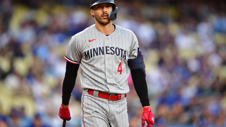 May 16, 2023; Los Angeles, California, USA; Minnesota Twins shortstop Carlos Correa (4) reacts after striking out against the Los Angeles Dodgers during the first inning at Dodger Stadium. Mandatory Credit: Gary A. Vasquez-USA TODAY Sports