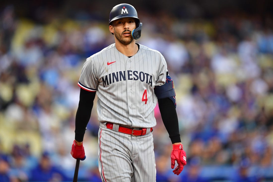 May 16, 2023; Los Angeles, California, USA; Minnesota Twins shortstop Carlos Correa (4) reacts after striking out against the Los Angeles Dodgers during the first inning at Dodger Stadium. Mandatory Credit: Gary A. Vasquez-USA TODAY Sports