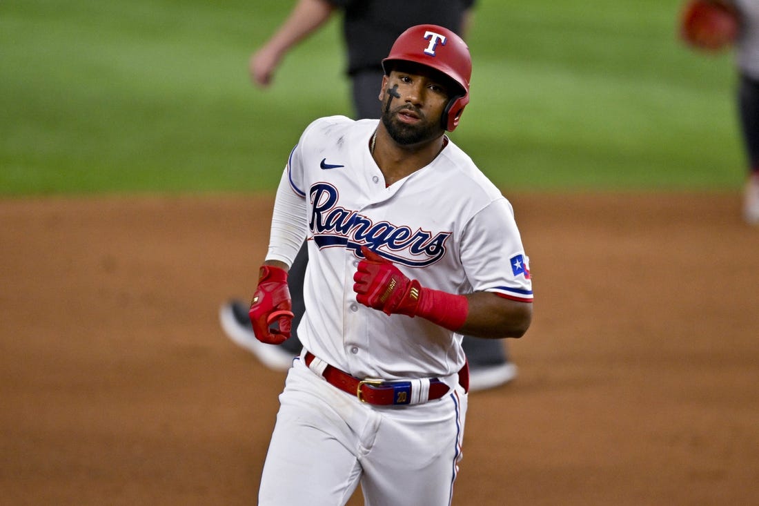 May 16, 2023; Arlington, Texas, USA; Texas Rangers shortstop Ezequiel Duran (20) rounds the bases after he hits a home run against the Atlanta Braves during the eighth inning at Globe Life Field. Mandatory Credit: Jerome Miron-USA TODAY Sports