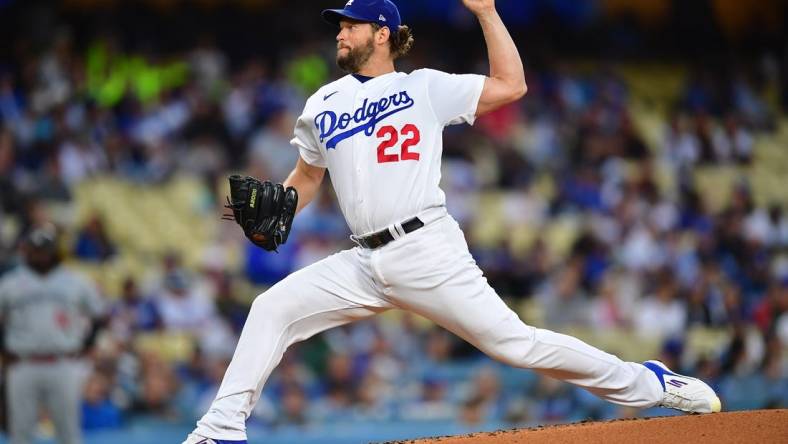 May 16, 2023; Los Angeles, California, USA; Los Angeles Dodgers starting pitcher Clayton Kershaw (22) throws against the Minnesota Twins during the second inning at Dodger Stadium. Mandatory Credit: Gary A. Vasquez-USA TODAY Sports