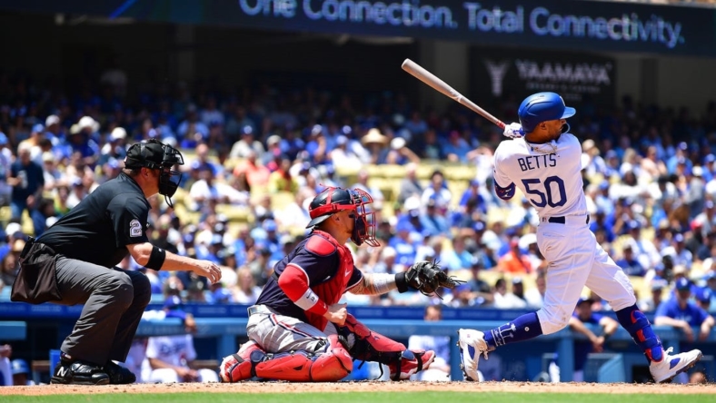 May 17, 2023; Los Angeles, California, USA; Los Angeles Dodgers right fielder Mookie Betts (50) hits an RBI single against the Minnesota Twins during the fourth inning at Dodger Stadium. Mandatory Credit: Gary A. Vasquez-USA TODAY Sports