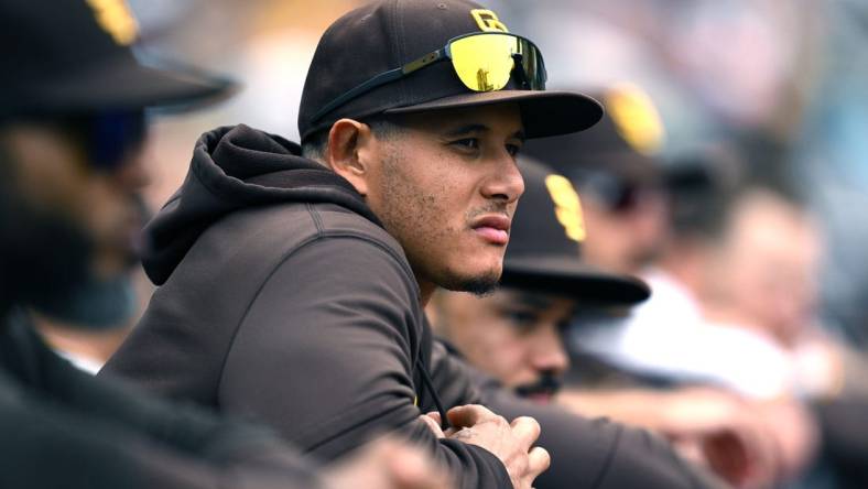 May 17, 2023; San Diego, California, USA; San Diego Padres third baseman Manny Machado (13) looks on from the dugout during the eighth inning against the Kansas City Royals at Petco Park. Mandatory Credit: Orlando Ramirez-USA TODAY Sports
