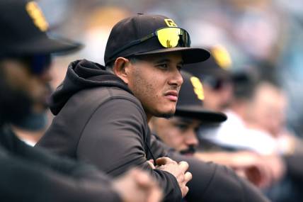 May 17, 2023; San Diego, California, USA; San Diego Padres third baseman Manny Machado (13) looks on from the dugout during the eighth inning against the Kansas City Royals at Petco Park. Mandatory Credit: Orlando Ramirez-USA TODAY Sports