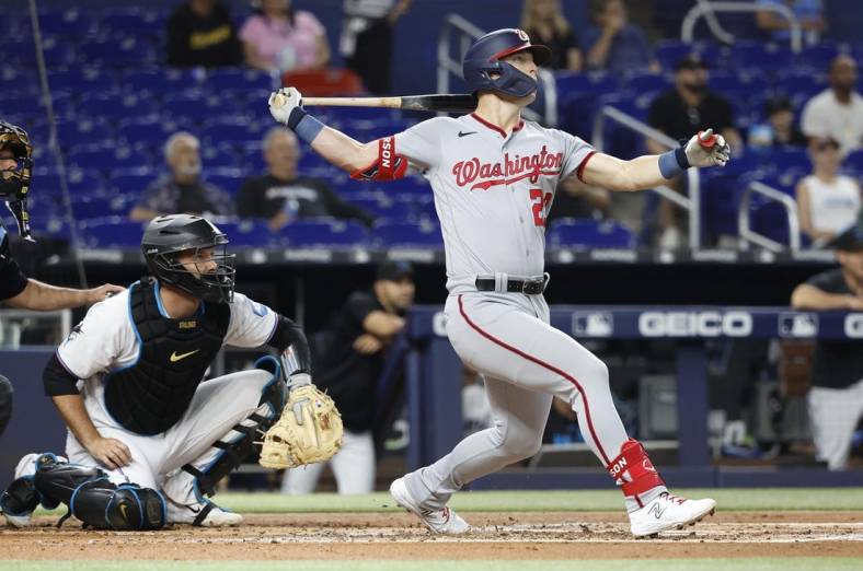 May 17, 2023; Miami, Florida, USA; Washington Nationals left fielder Corey Dickerson (23) hits a home run against the Miami Marlins during the second inning at loanDepot Park. Mandatory Credit: Rhona Wise-USA TODAY Sports