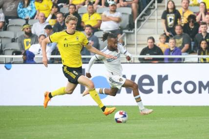 May 17, 2023; Columbus, Ohio, USA; Columbus Crew defender Philip Quinton (2) fight for the ball against Los Angeles Galaxy forward Raheem Edwards (44) during the first half at Lower.com Field. Mandatory Credit: Trevor Ruszkowski-USA TODAY Sports