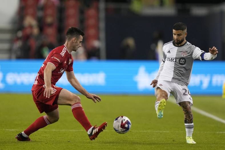 May 17, 2023; Toronto, Ontario, CAN; New York Red Bulls defender Dylan Nealis (12) and Toronto FC forward Lorenzo Insigne (24) battle for the ball in the second half at BMO Field. Mandatory Credit: Kevin Sousa-USA TODAY Sports
