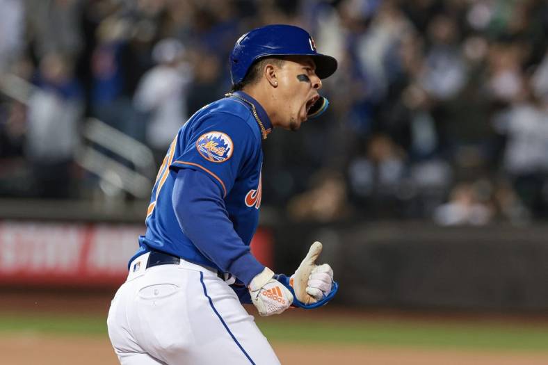 May 17, 2023; New York City, New York, USA; New York Mets third baseman Mark Vientos (27) reacts after hitting a two-run home run during the seventh inning against the Tampa Bay Rays at Citi Field. Mandatory Credit: Vincent Carchietta-USA TODAY Sports