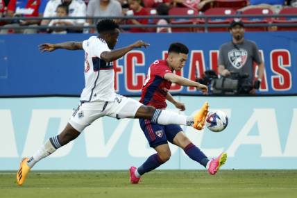 May 17, 2023; Frisco, Texas, USA; Vancouver Whitecaps midfielder Jean-Claude Ngando (26) defends against FC Dallas forward Alan Velasco (20) in the first half at Toyota Stadium. Mandatory Credit: Tim Heitman-USA TODAY Sports