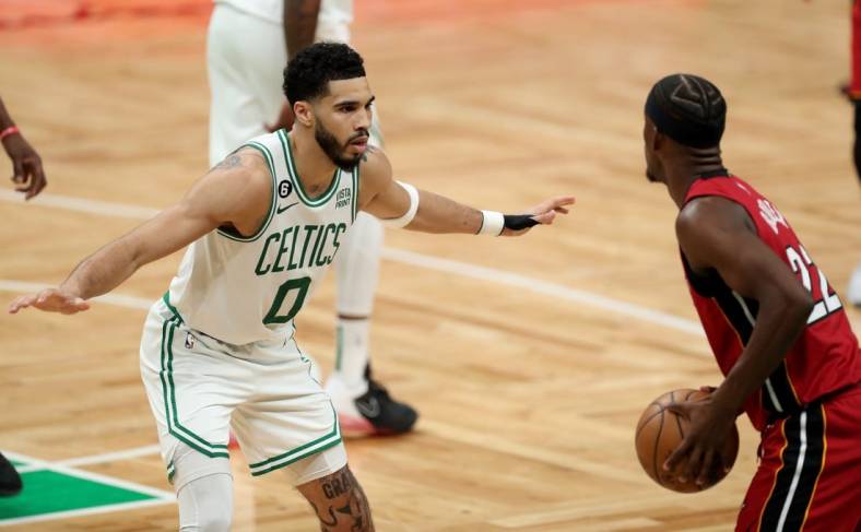 May 17, 2023; Boston, Massachusetts, USA; Boston Celtics forward Jayson Tatum (0) guards Miami Heat forward Jimmy Butler (22) during the second half in game one of the Eastern Conference Finals for the 2023 NBA playoffs at TD Garden. Mandatory Credit: Paul Rutherford-USA TODAY Sports