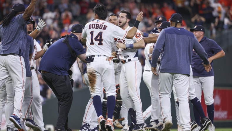 May 17, 2023; Houston, Texas, USA; Houston Astros designated hitter Kyle Tucker (30) celebrates with teammates after hitting a game-winning walk-off single during the ninth inning against the Chicago Cubs at Minute Maid Park. Mandatory Credit: Troy Taormina-USA TODAY Sports