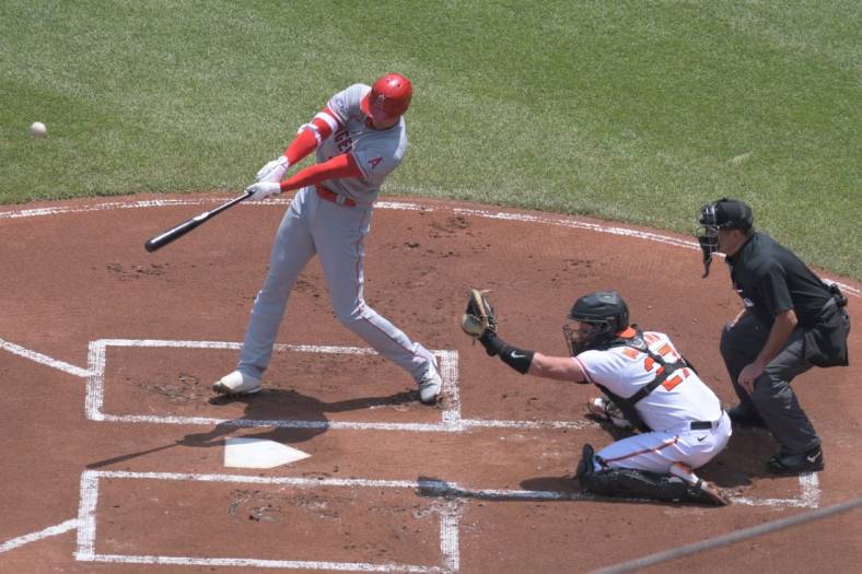 May 18, 2023; Baltimore, Maryland, USA;  Los Angeles Angels designated hitter Shohei Ohtani (17) swings through a first inning home run against the Baltimore Orioles at Oriole Park at Camden Yards. Mandatory Credit: Tommy Gilligan-USA TODAY Sports