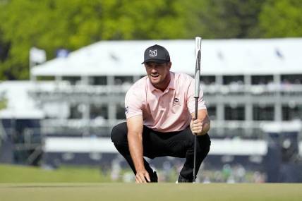May 18, 2023; Rochester, New York, USA; Bryson DeChambeau lines up a putt on the ninth green during the first round of the PGA Championship golf tournament at Oak Hill Country Club. Mandatory Credit: Adam Cairns-USA TODAY Sports