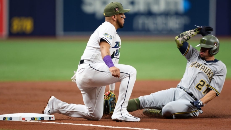 May 19, 2023; St. Petersburg, Florida, USA;  Milwaukee Brewers shortstop Willy Adames (27) is tagged out at third base by Tampa Bay Rays third baseman Isaac Paredes (17) in the second inning at Tropicana Field. Mandatory Credit: Nathan Ray Seebeck-USA TODAY Sports