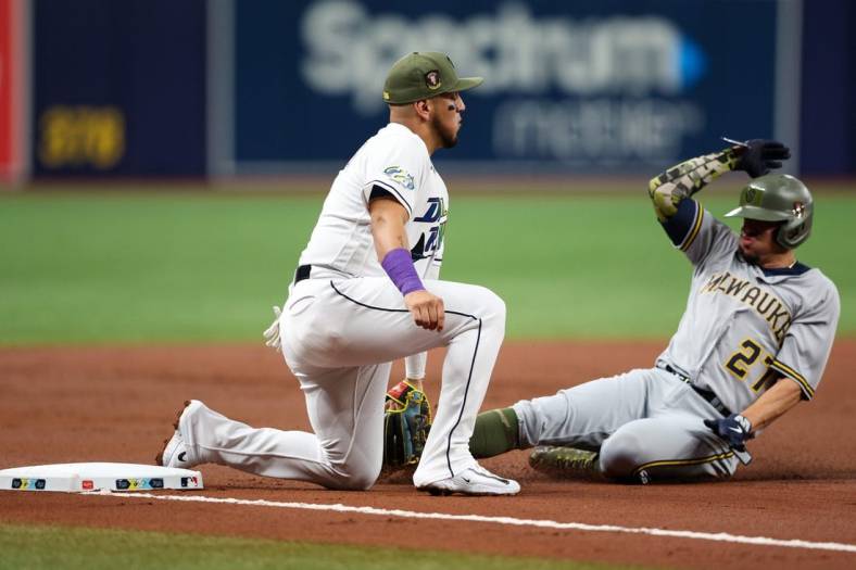 May 19, 2023; St. Petersburg, Florida, USA;  Milwaukee Brewers shortstop Willy Adames (27) is tagged out at third base by Tampa Bay Rays third baseman Isaac Paredes (17) in the second inning at Tropicana Field. Mandatory Credit: Nathan Ray Seebeck-USA TODAY Sports