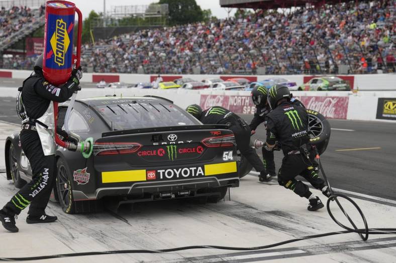 May 19, 2023; North Wilkesboro, North Carolina, USA;  Nascar Cup Series driver Ty Gibbs (54) crew sets the pace during the Pit Crew Challenge and Qualifier at North Wilkesboro Speedway. Mandatory Credit: Jim Dedmon-USA TODAY Sports