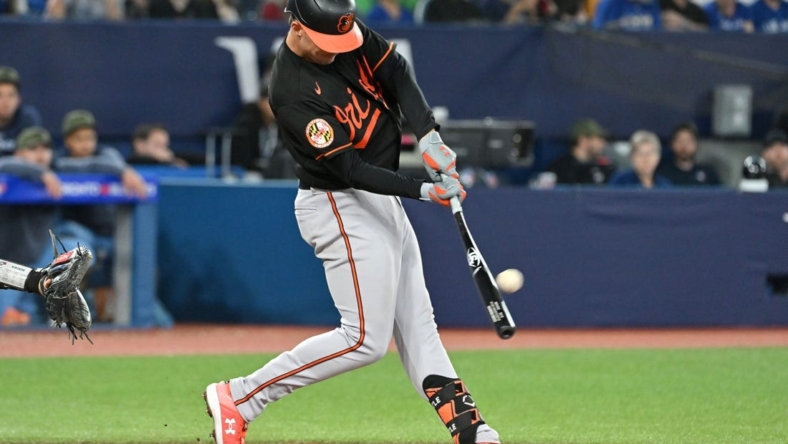 May 19, 2023; Toronto, Ontario, CAN;   Baltimore Orioles first baseman Ryan Mountcastle (6) hits a three run home run against the Toronto Blue Jays in the third inning at Rogers Centre. Mandatory Credit: Dan Hamilton-USA TODAY Sports