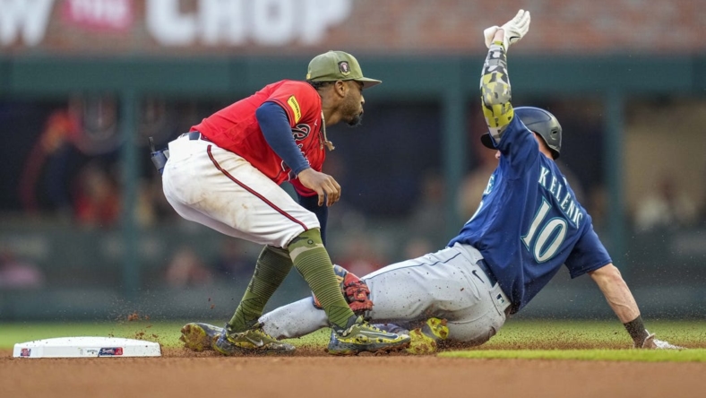 May 19, 2023; Cumberland, Georgia, USA; Seattle Mariners left fielder Jarred Kelenic (10) is tagged out by Atlanta Braves second baseman Ozzie Albies (1) while trying to steal second base during the fourth inning at Truist Park. Mandatory Credit: Dale Zanine-USA TODAY Sports