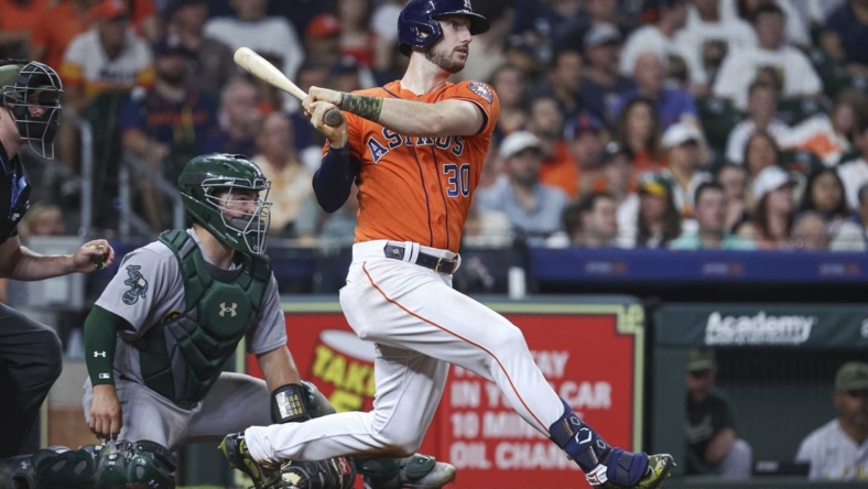 May 19, 2023; Houston, Texas, USA; Houston Astros right fielder Kyle Tucker (30) hits an RBI double during the fourth inning against the Oakland Athletics at Minute Maid Park. Mandatory Credit: Troy Taormina-USA TODAY Sports