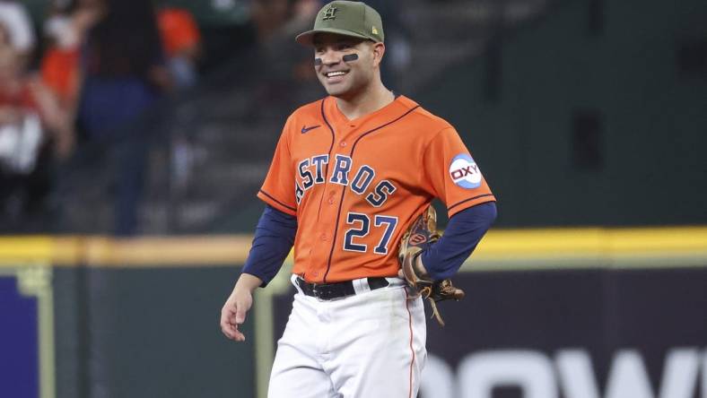 May 19, 2023; Houston, Texas, USA; Houston Astros second baseman Jose Altuve (27) smiles during the first inning against the Oakland Athletics at Minute Maid Park. Mandatory Credit: Troy Taormina-USA TODAY Sports