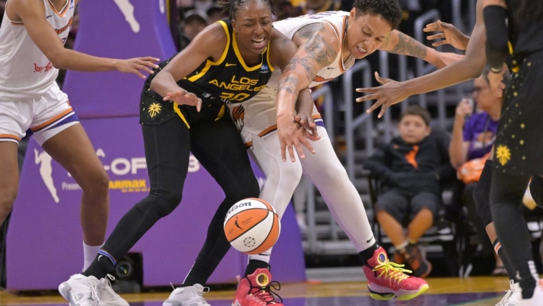May 19, 2023; Los Angeles, California, USA;  Los Angeles Sparks forward Nneka Ogwumike (30) and Phoenix Mercury center Brittney Griner (42) reach for a loose ball in the second half at Crypto.com Arena. Mandatory Credit: Jayne Kamin-Oncea-USA TODAY Sports