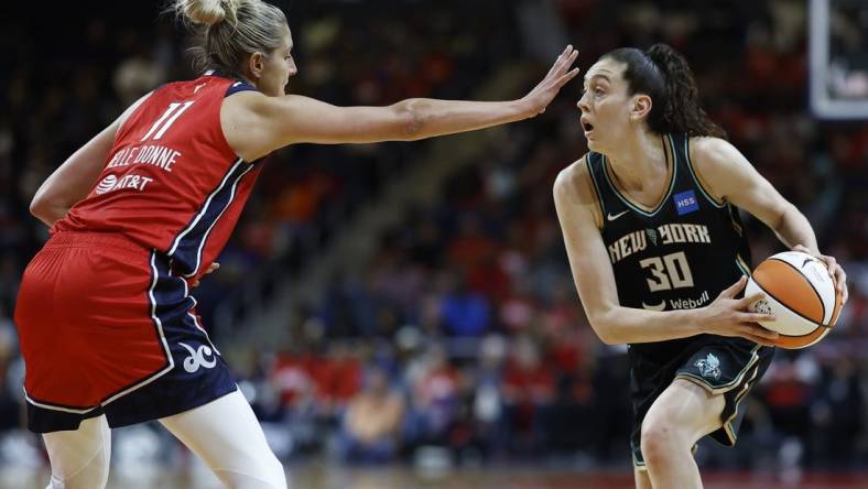 May 19, 2023; Washington, District of Columbia, USA; New York Liberty forward Breanna Stewart (30) holds the ball as Washington Mystics forward Elena Delle Donne (11) defends at Entertainment & Sports Arena. Mandatory Credit: Geoff Burke-USA TODAY Sports