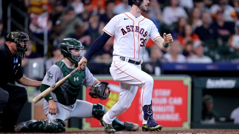 May 20, 2023; Houston, Texas, USA; Houston Astros right fielder Kyle Tucker (30) hits an RBI single against the Oakland Athletics during the first inning at Minute Maid Park. Mandatory Credit: Erik Williams-USA TODAY Sports