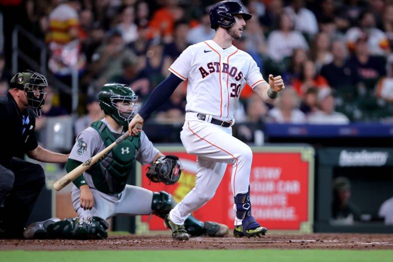 May 20, 2023; Houston, Texas, USA; Houston Astros right fielder Kyle Tucker (30) hits an RBI single against the Oakland Athletics during the first inning at Minute Maid Park. Mandatory Credit: Erik Williams-USA TODAY Sports