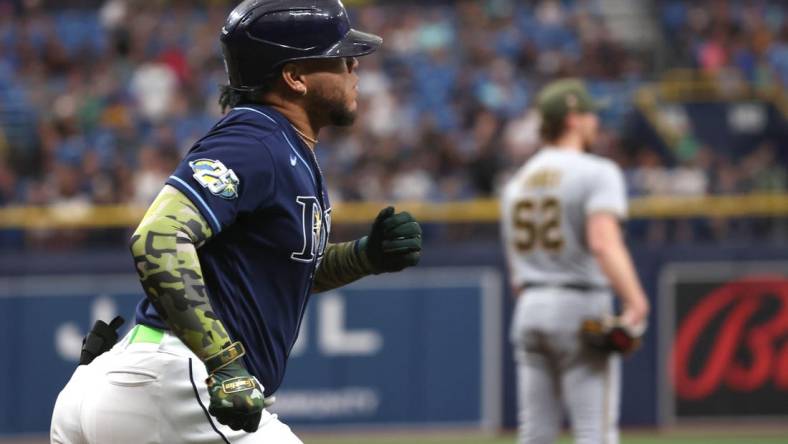 May 20, 2023; St. Petersburg, Florida, USA;Tampa Bay Rays designated hitter Harold Ramirez (43) hits a home run as Milwaukee Brewers starting pitcher Eric Lauer (52) looks on during the first inning  at Tropicana Field. Mandatory Credit: Kim Klement-USA TODAY Sports