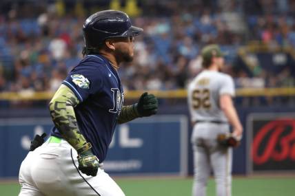 May 20, 2023; St. Petersburg, Florida, USA;Tampa Bay Rays designated hitter Harold Ramirez (43) hits a home run as Milwaukee Brewers starting pitcher Eric Lauer (52) looks on during the first inning  at Tropicana Field. Mandatory Credit: Kim Klement-USA TODAY Sports