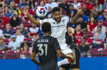 May 20, 2023; Frisco, Texas, USA;  FC Dallas forward Jesus Ferreira (10) tries to head a ball in front of Houston Dynamo defender Micael (31) during the first half at Toyota Stadium. Mandatory Credit: Kevin Jairaj-USA TODAY Sports