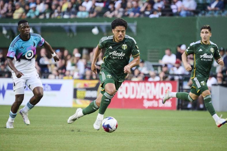 May 20, 2023; Portland, Oregon, USA; Portland Timbers midfielder Evander (20) controls a pass during the first half against Minnesota United at Providence Park. Mandatory Credit: Troy Wayrynen-USA TODAY Sports