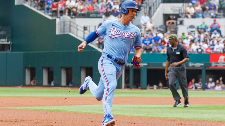 May 21, 2023; Arlington, Texas, USA; Texas Rangers third baseman Josh Jung (6) hits a home run during the second inning against the Colorado Rockies at Globe Life Field. Mandatory Credit: Andrew Dieb-USA TODAY Sports