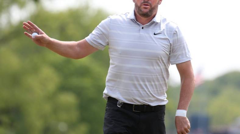 Michael Block waves to fans after his par putt on the 4th hole during the final round at the PGA Championship at Oak Hill Country Club Sunday, May 21, 2023.