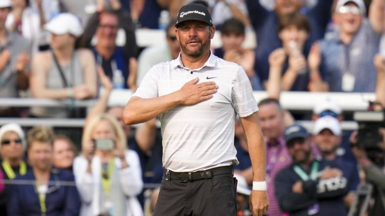 May 21, 2023; Rochester, New York, USA; Michael Block anckolwedges the fans on the 18th green during the final round of the PGA Championship golf tournament at Oak Hill Country Club. Mandatory Credit: Aaron Doster-USA TODAY Sports