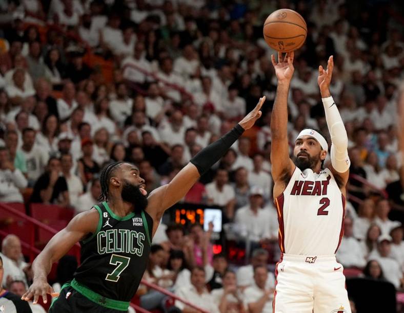 May 21, 2023; Miami, Florida, USA; Miami Heat guard Gabe Vincent (2) shoots against Boston Celtics guard Jaylen Brown (7) during the first half in game three of the Eastern Conference Finals for the 2023 NBA playoffs at Kaseya Center. Mandatory Credit: Jim Rassol-USA TODAY Sports
