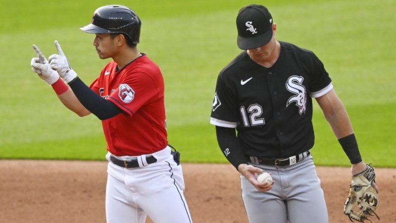 May 22, 2023; Cleveland, Ohio, USA; Cleveland Guardians left fielder Steven Kwan (38) celebrates his double beside Chicago White Sox second baseman Romy Gonzalez (12) in the third inning at Progressive Field. Mandatory Credit: David Richard-USA TODAY Sports