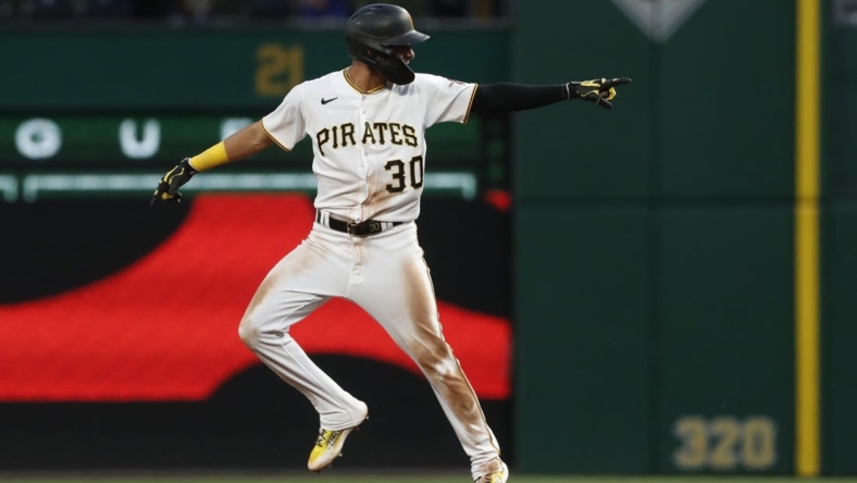 May 22, 2023; Pittsburgh, Pennsylvania, USA;  Pittsburgh Pirates shortstop Tucupita Marcano (30) reacts as he circles the bases on a grand slam home run against the Texas Rangers during the seventh inning at PNC Park. Mandatory Credit: Charles LeClaire-USA TODAY Sports