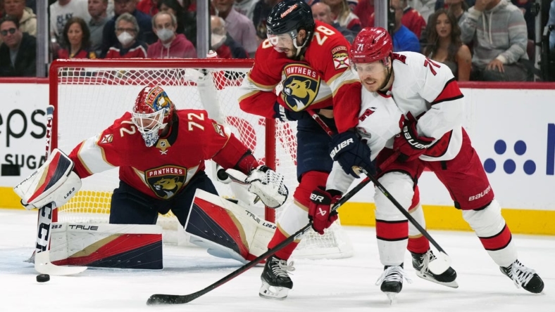 May 22, 2023; Sunrise, Florida, USA; Florida Panthers goaltender Sergei Bobrovsky (72) makes a save behind defenseman Josh Mahura (28) and Carolina Hurricanes right wing Jesper Fast (71) during the first period in game three of the Eastern Conference Finals of the 2023 Stanley Cup Playoffs at FLA Live Arena. Mandatory Credit: Jasen Vinlove-USA TODAY Sports
