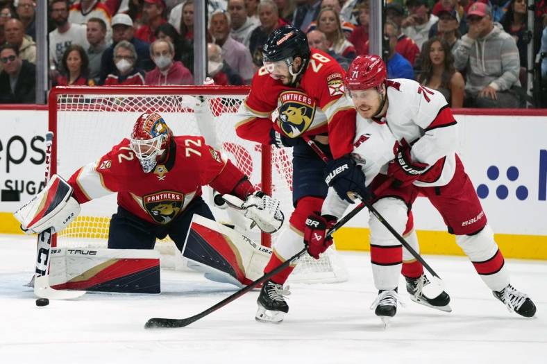 May 22, 2023; Sunrise, Florida, USA; Florida Panthers goaltender Sergei Bobrovsky (72) makes a save behind defenseman Josh Mahura (28) and Carolina Hurricanes right wing Jesper Fast (71) during the first period in game three of the Eastern Conference Finals of the 2023 Stanley Cup Playoffs at FLA Live Arena. Mandatory Credit: Jasen Vinlove-USA TODAY Sports