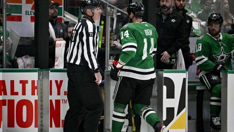 May 23, 2023; Dallas, Texas, USA; Dallas Stars left wing Jamie Benn (14) leaves the ice after receiving a game misconnect for a cross check on Vegas Golden Knights right wing Jonathan Marchessault (81) during the first period in game three of the Western Conference Finals of the 2023 Stanley Cup Playoffs at American Airlines Center. Mandatory Credit: Jerome Miron-USA TODAY Sports