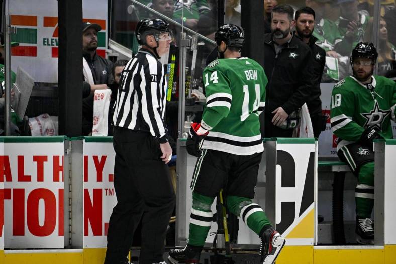 May 23, 2023; Dallas, Texas, USA; Dallas Stars left wing Jamie Benn (14) leaves the ice after receiving a game misconnect for a cross check on Vegas Golden Knights right wing Jonathan Marchessault (81) during the first period in game three of the Western Conference Finals of the 2023 Stanley Cup Playoffs at American Airlines Center. Mandatory Credit: Jerome Miron-USA TODAY Sports