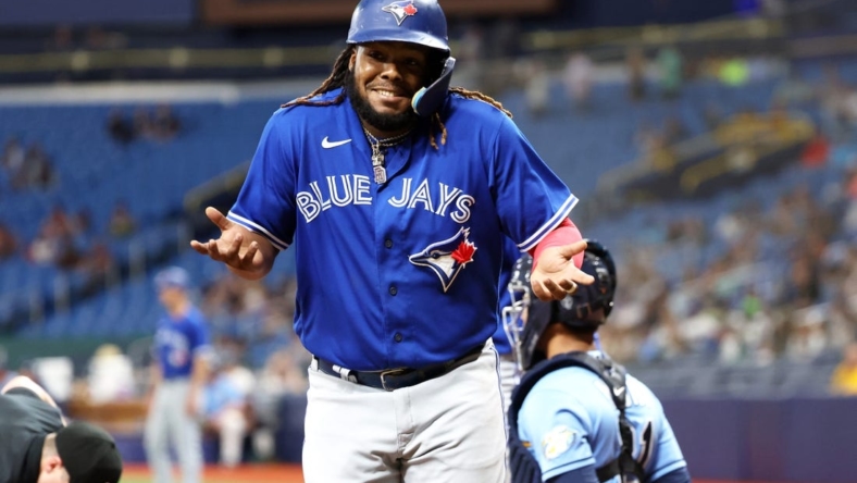 May 23, 2023; St. Petersburg, Florida, USA; Toronto Blue Jays first baseman Vladimir Guerrero Jr. (27) celebrates after he hit a grand slam against the Tampa Bay Rays during the ninth inning at Tropicana Field. Mandatory Credit: Kim Klement-USA TODAY Sports