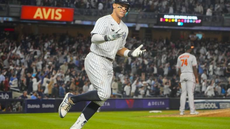 May 23, 2023; Bronx, New York, USA; New York Yankees right fielder Aaron Judge (99) reacts to hitting a home run against the Baltimore Orioles during the ninth inning at Yankee Stadium. Mandatory Credit: Gregory Fisher-USA TODAY Sports