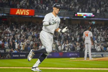 May 23, 2023; Bronx, New York, USA; New York Yankees right fielder Aaron Judge (99) reacts to hitting a home run against the Baltimore Orioles during the ninth inning at Yankee Stadium. Mandatory Credit: Gregory Fisher-USA TODAY Sports